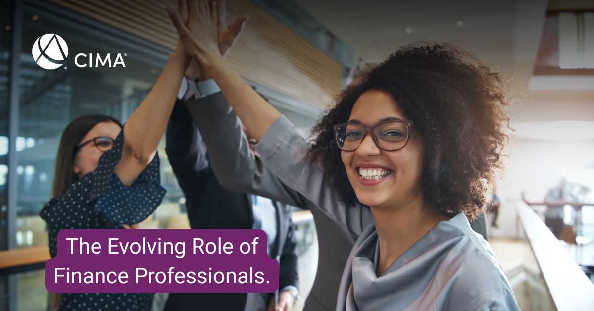 2 young female finance professionals, 1 young male finance professionals - High Five'ing